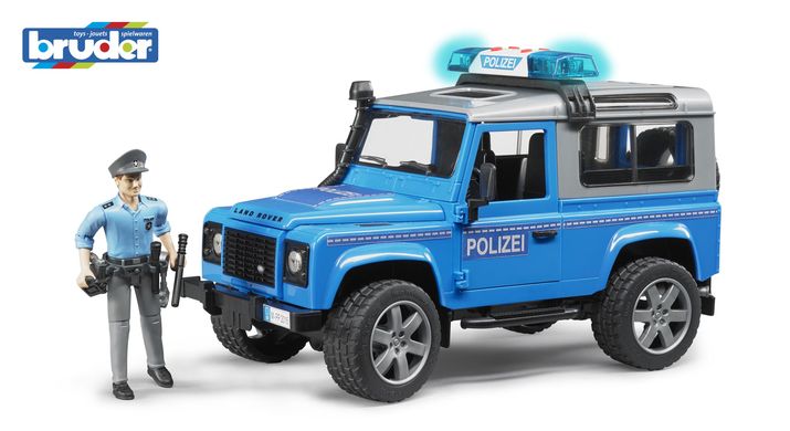 Іграшка - джип Поліція Land Rover Defender синій, світло і звук, + фігурка поліцейського, М1: 16 Bruder 2597